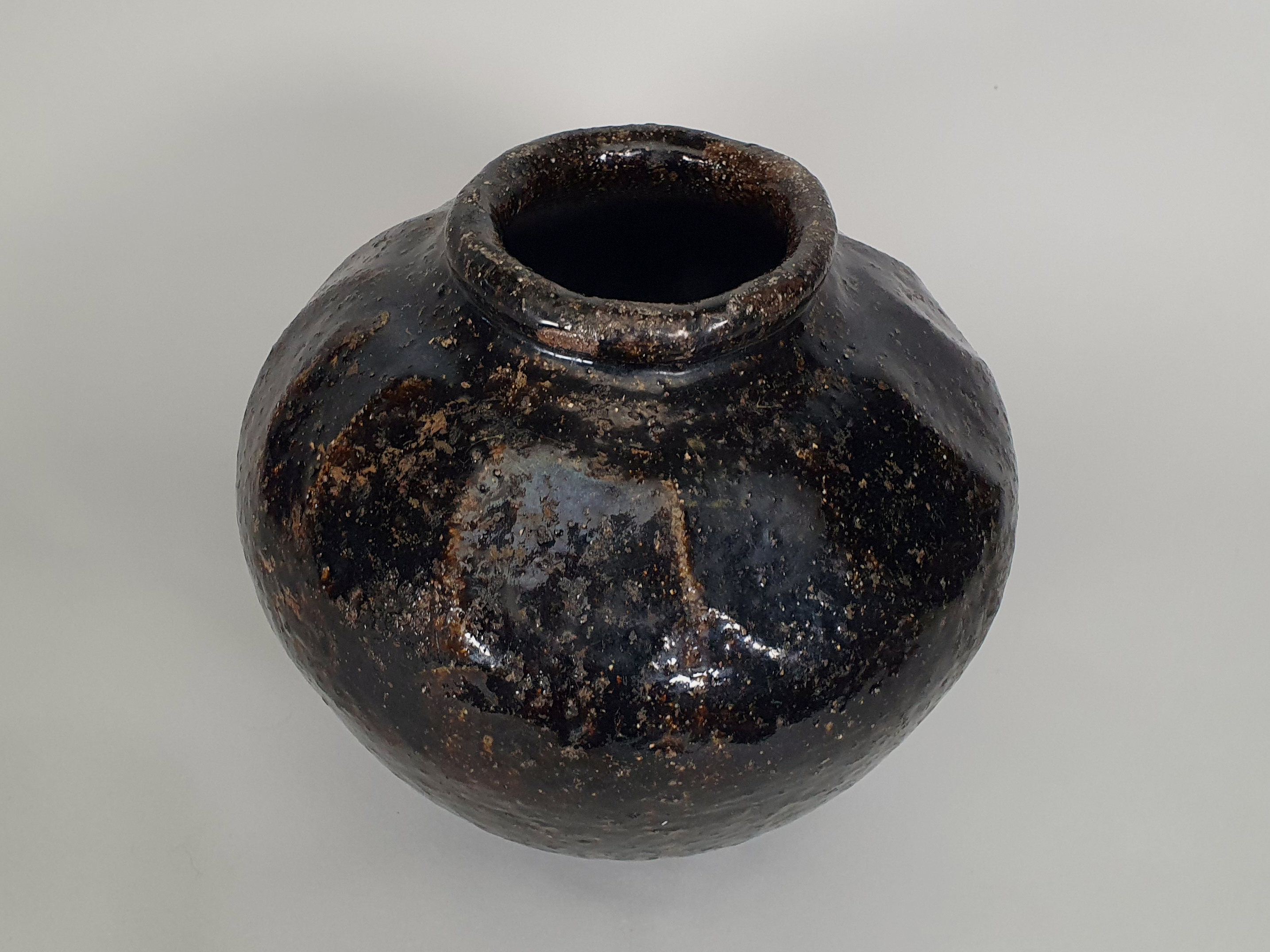 Antique stoneware Chinese wine flagon from angle