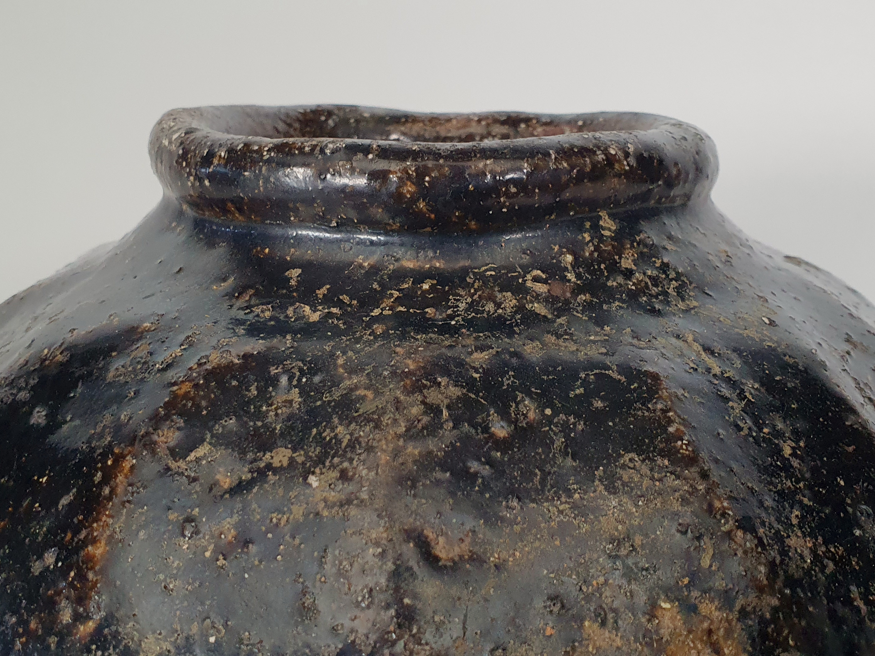 Antique stoneware Chinese wine flagon close up of neck
