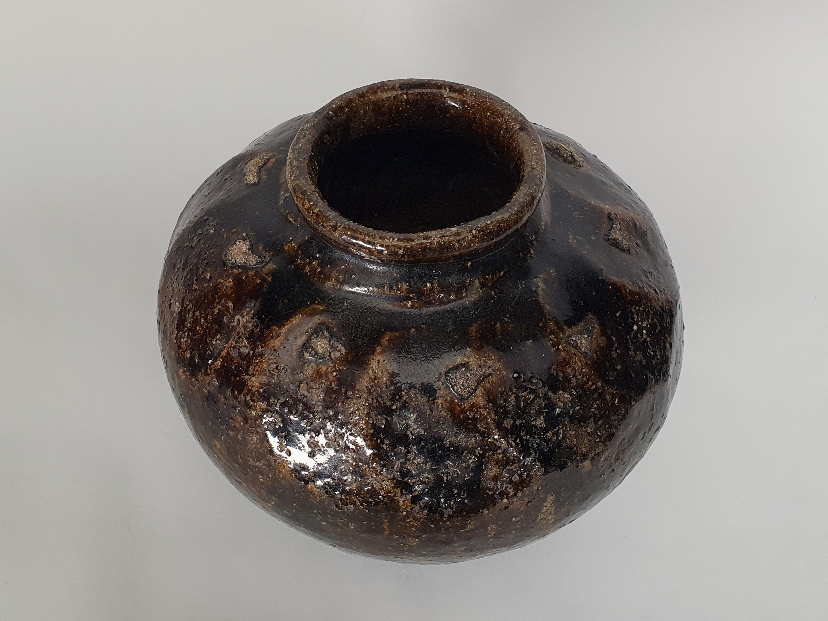 Antique stoneware Chinese wine flagon from angle