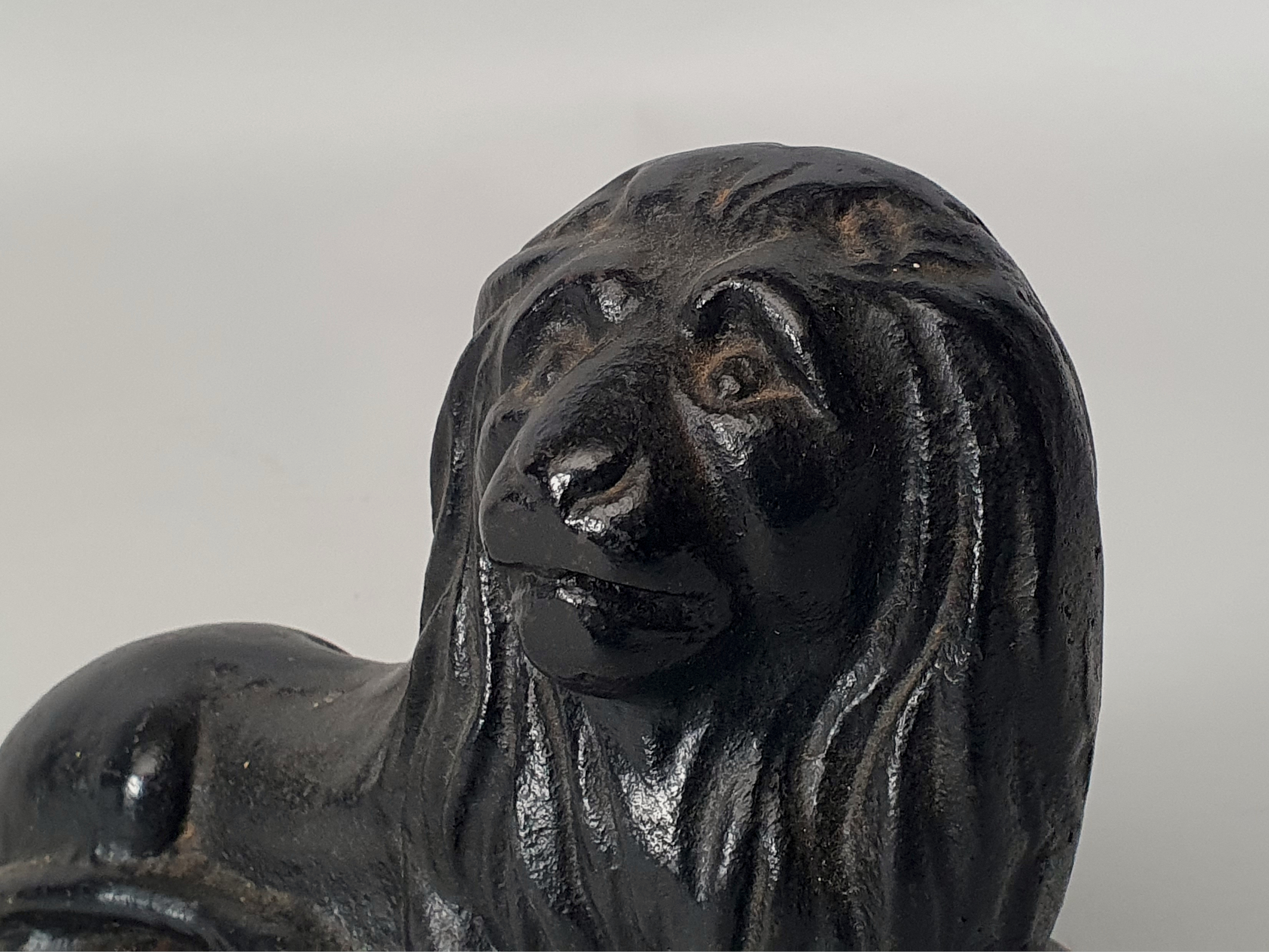 cast iron Lion Door Stop or Door Porter side view
