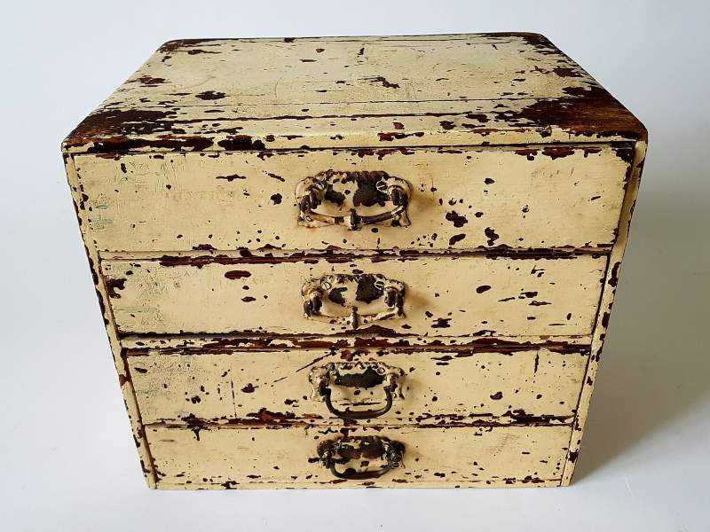 Small Bank of Drawers in original cream paint