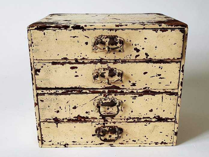 Small Bank of Drawers in original cream paint
