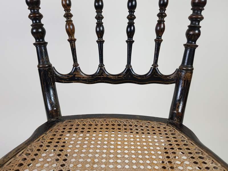 Pair of ebonised cane French salon chairs