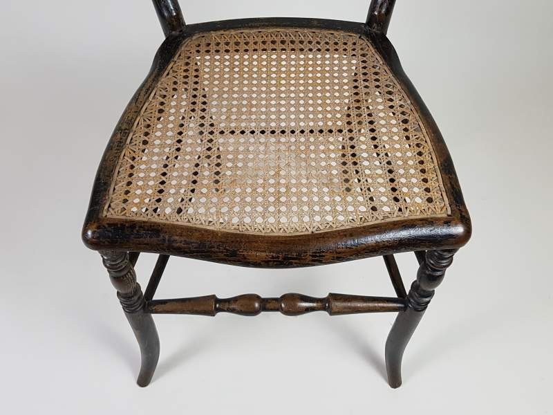 Pair of ebonised cane French salon chairs