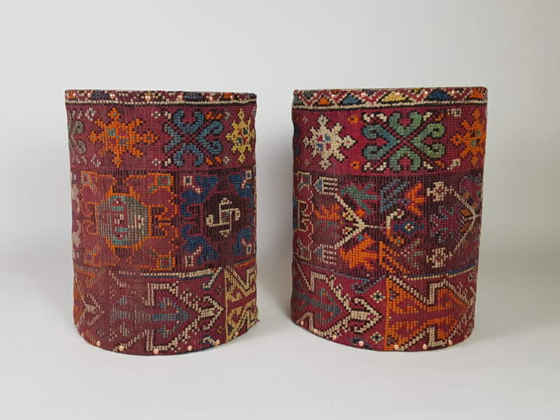 Pair of cylindrical Side Tables covered in antique kilim
