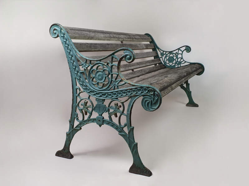 19th century cast iron ornate Victorian garden bench in old turquoise paint