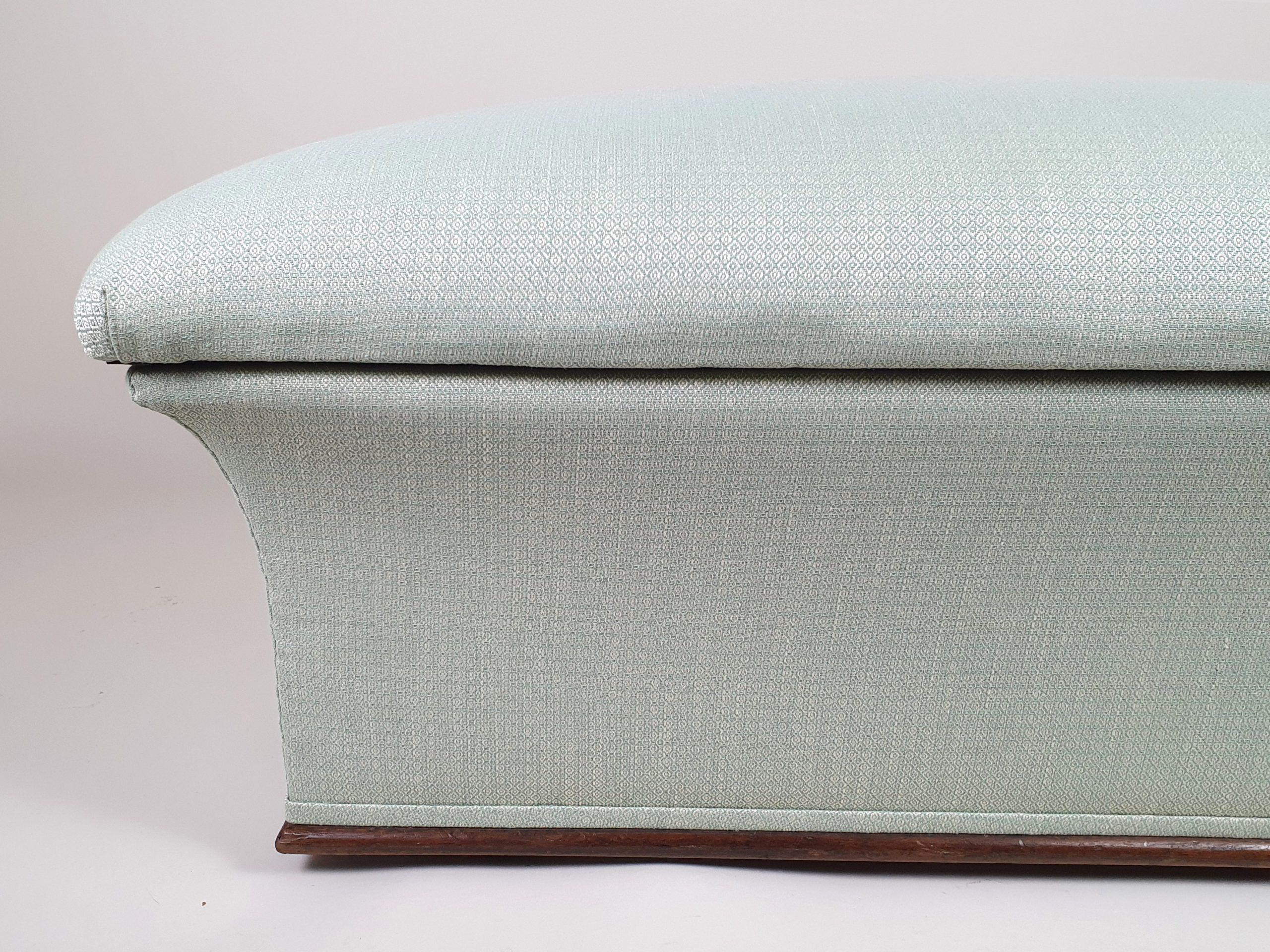 Victorian concave Ottoman, reupholstered in a peppermint geometric fabric