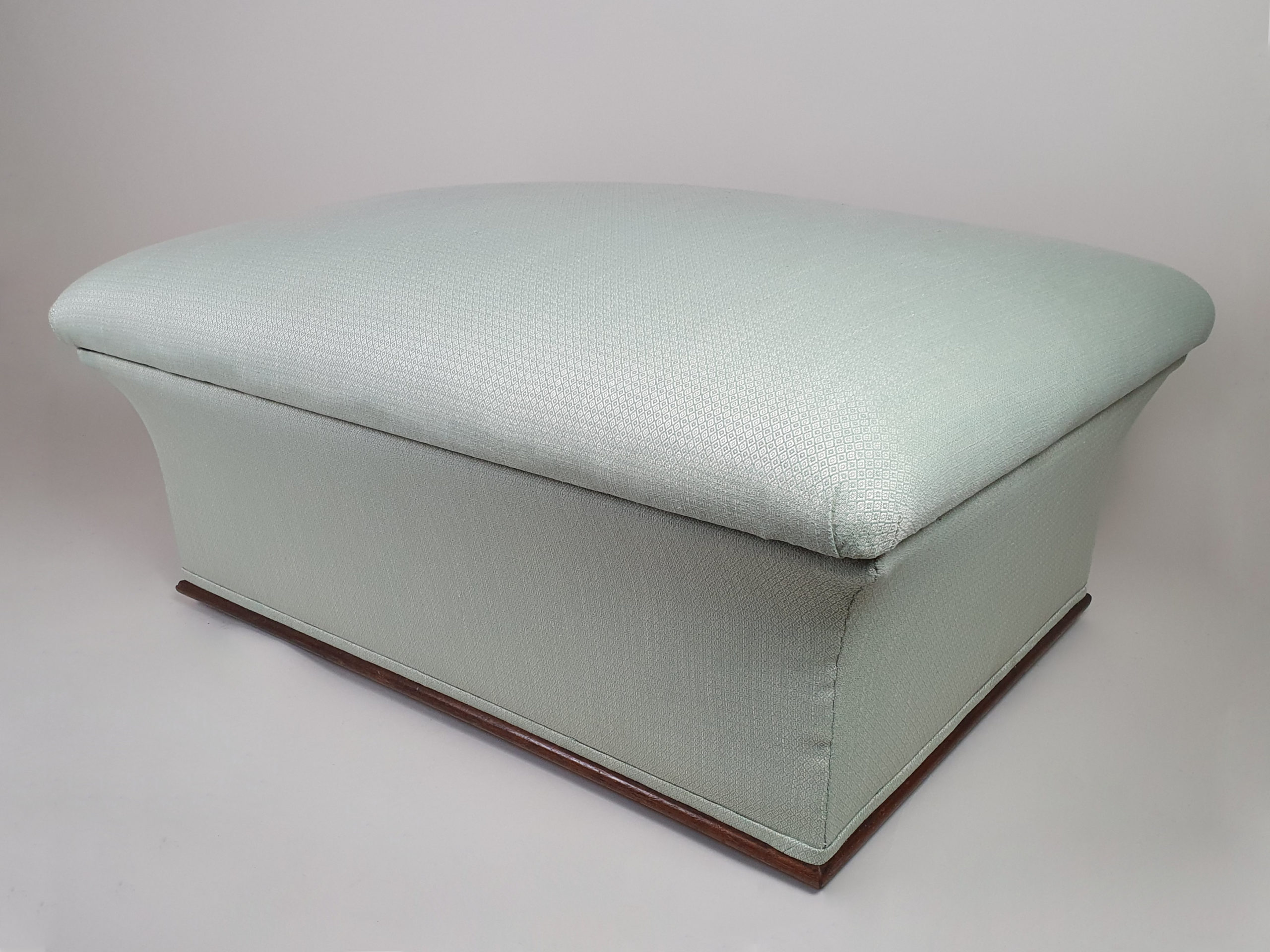 Victorian concave Ottoman, reupholstered in a peppermint geometric fabric