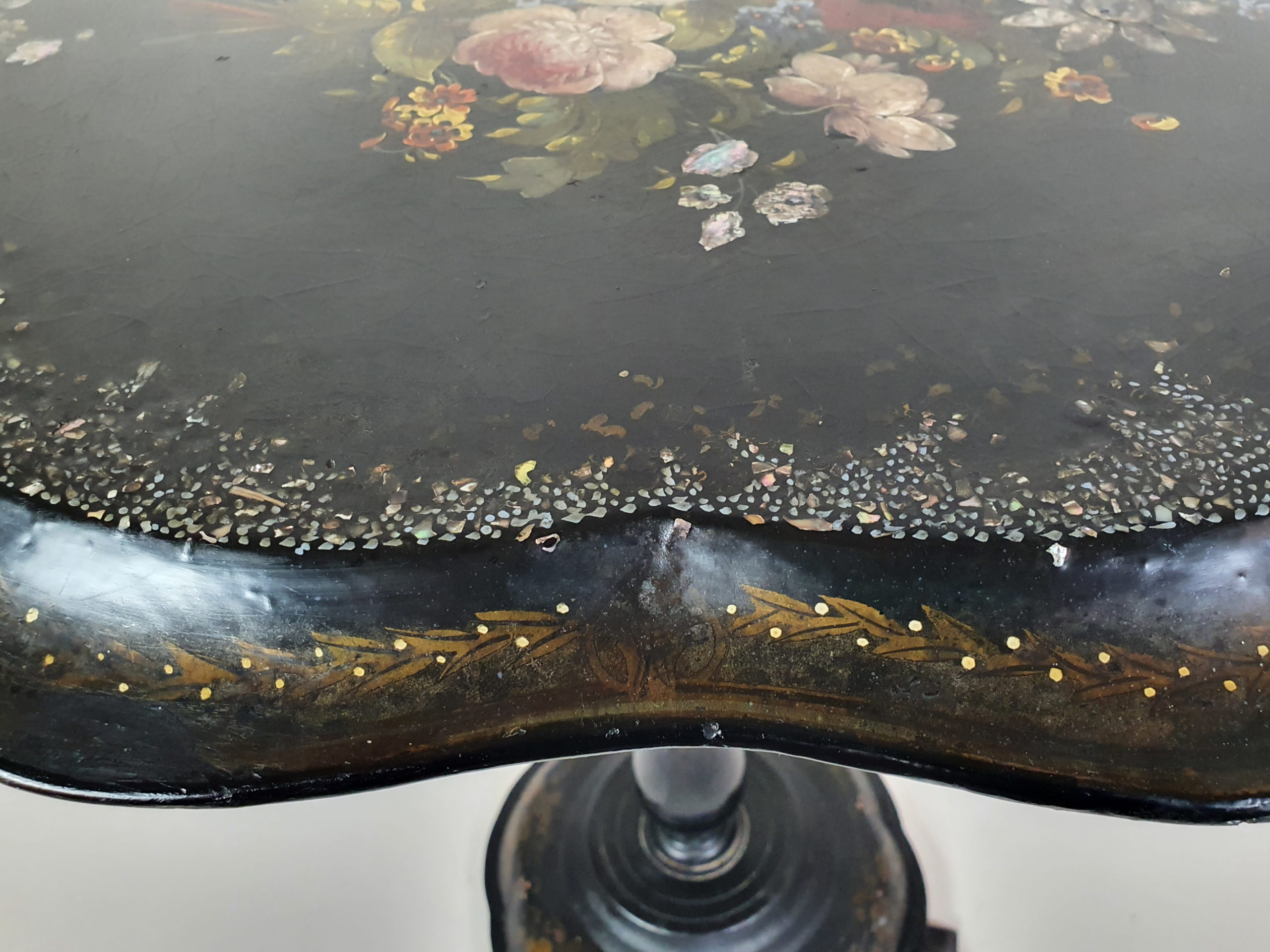 Victorian tilt top papier maché Table with a floral mother of pearl inlay
