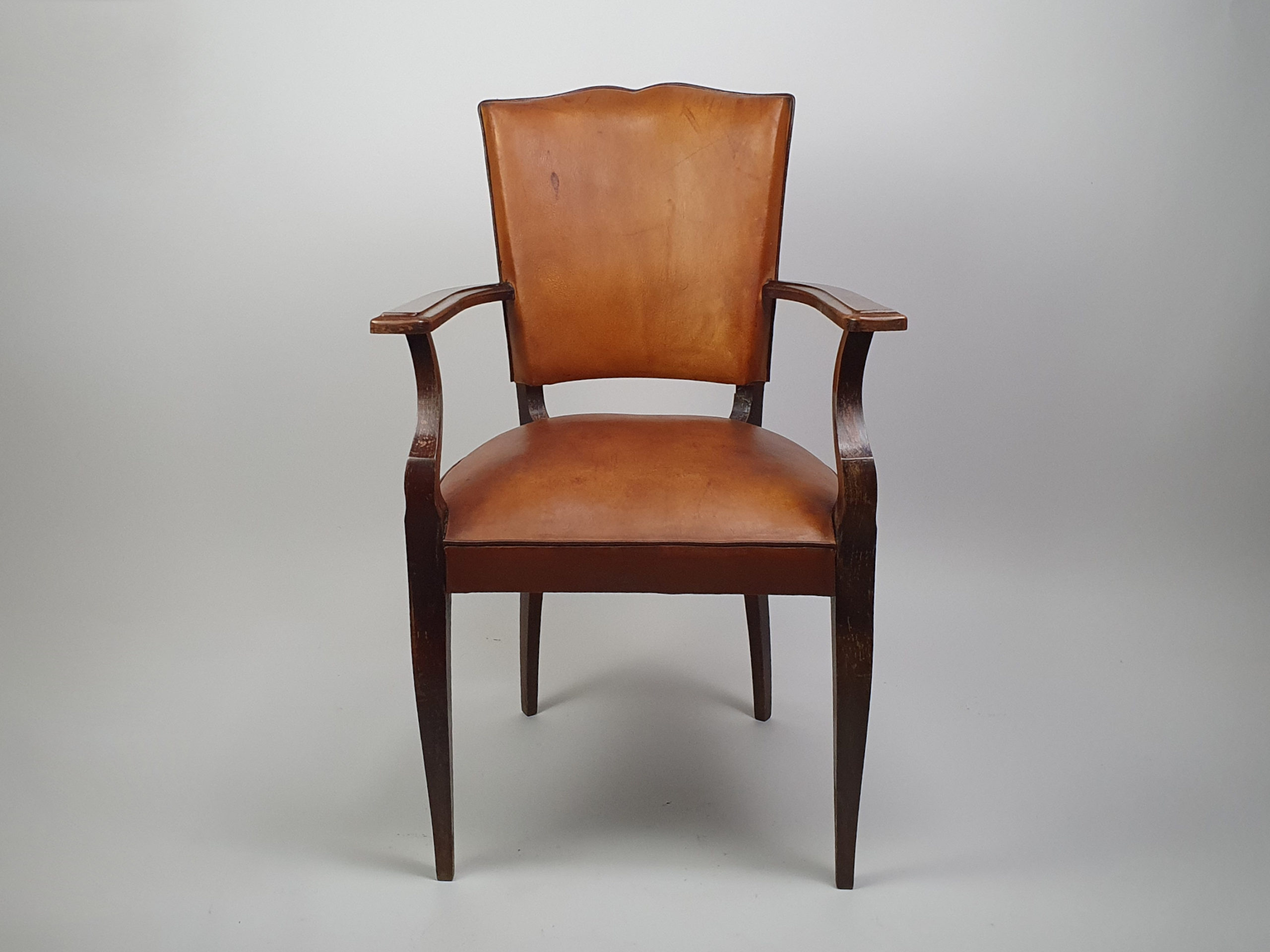 A pair of 20th century antique leather moustache Chairs