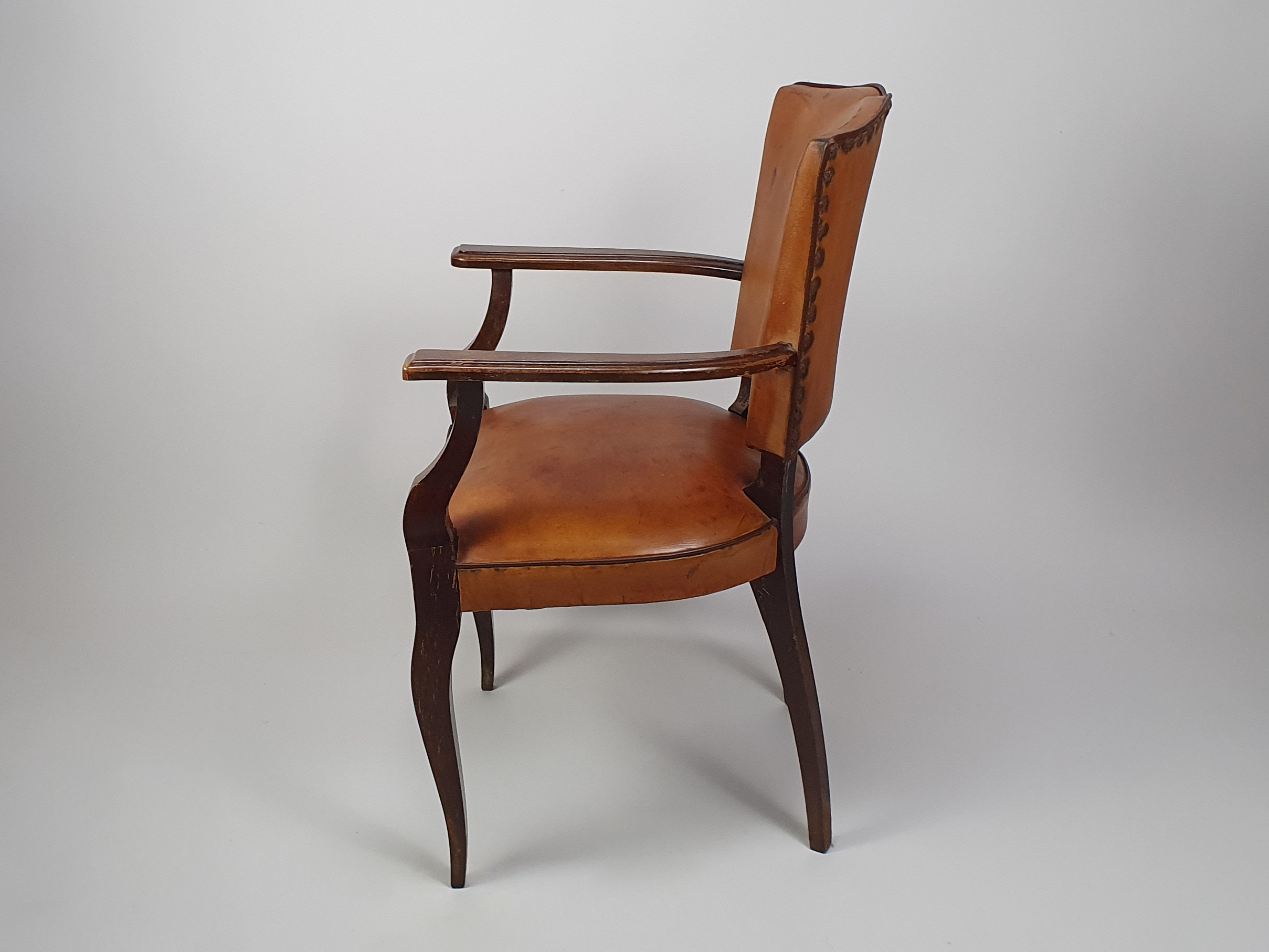 A pair of 20th century antique leather moustache Chairs