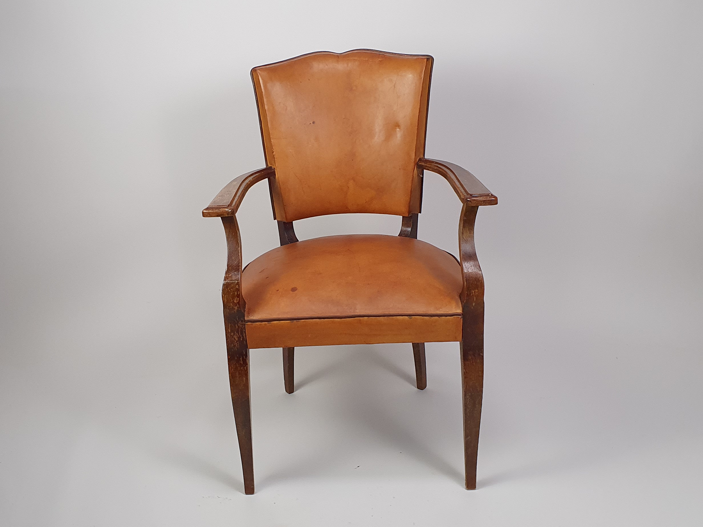A pair of 20th century antique leather moustache Chairs