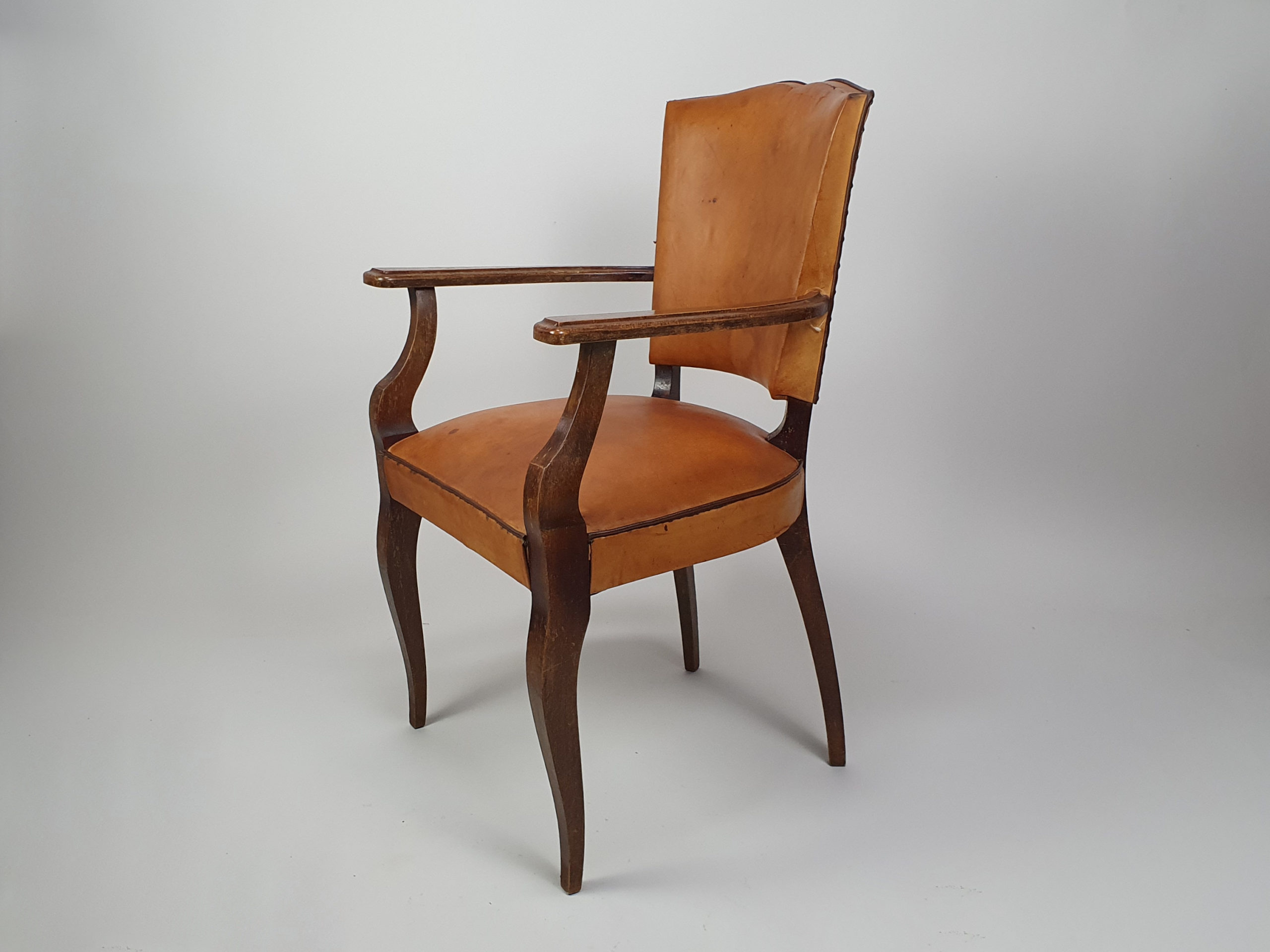 A pair of 20th century antique leather moustache Chairs