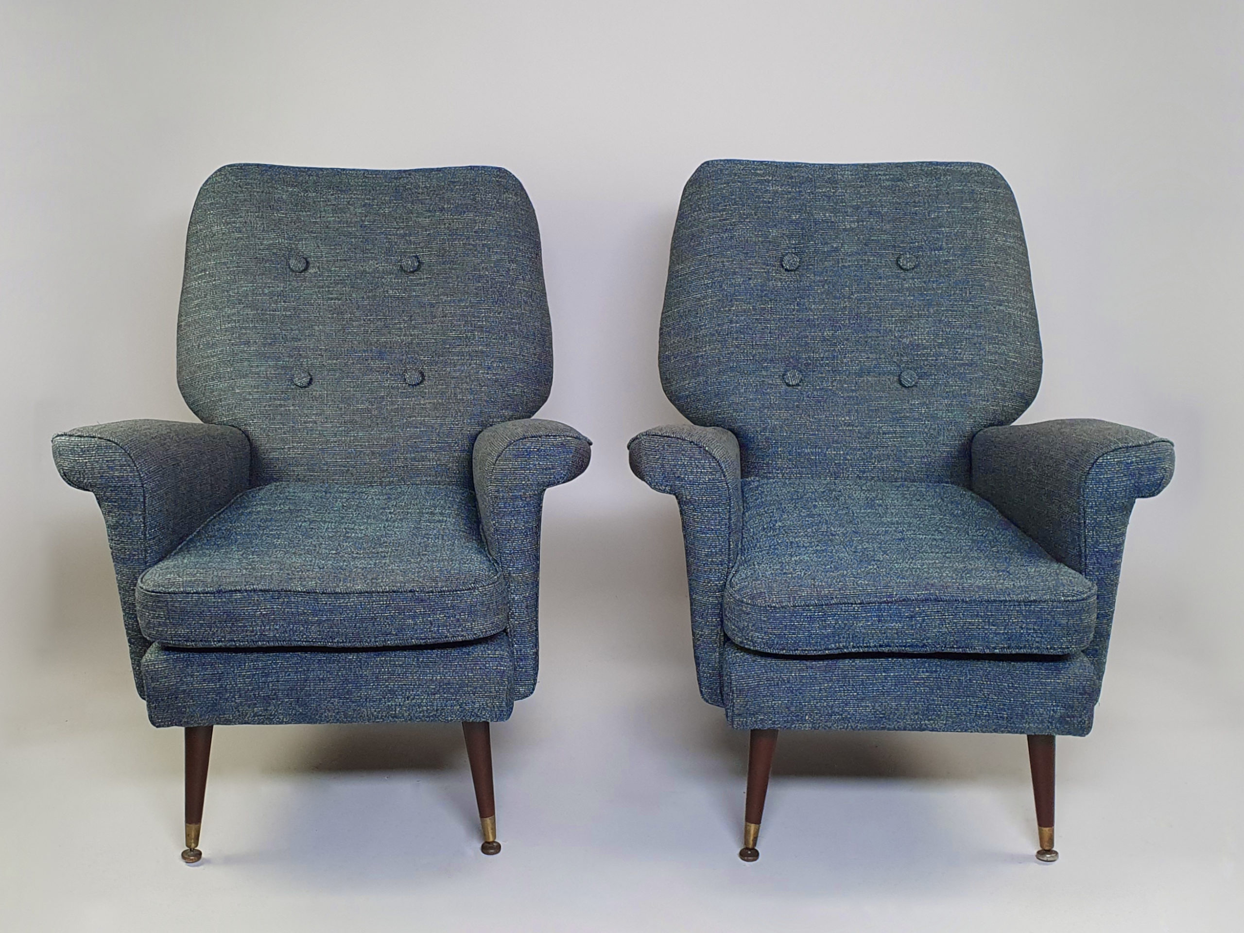 A smart pair of distinctively designed mid century Armchairs