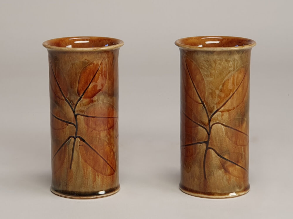 A pair of Royal Doulton stoneware vases - autumn foliage & autumn leaves, by Maud Bowden