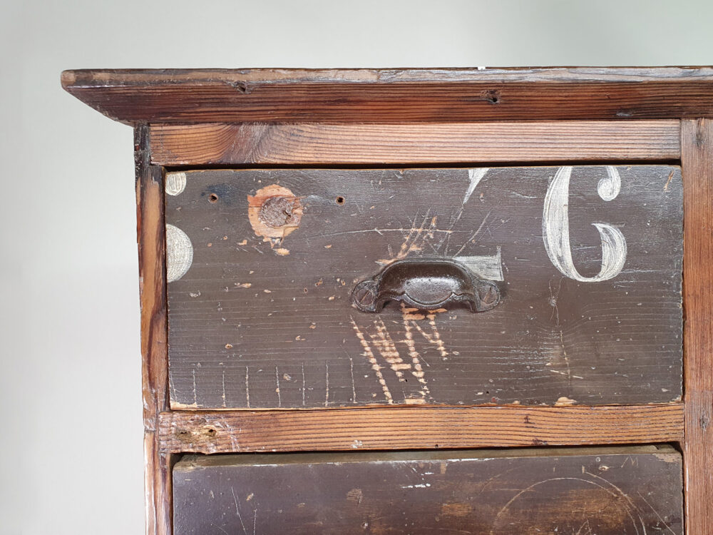 Antique Bank of Drawers with original lettering