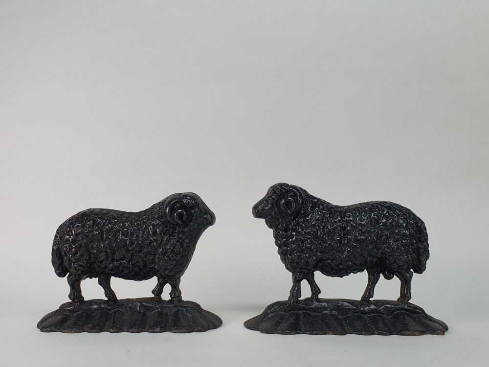 Antique cast iron matched pair of male and female Black Sheep