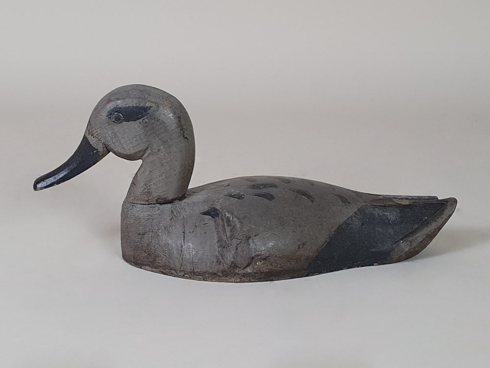 Grey antique wooden Decoy Duck