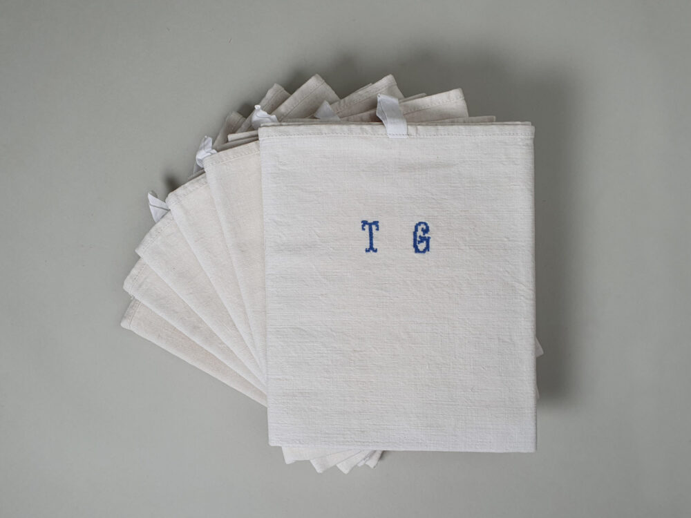 Antique linen hand woven Torchons, or Tea Towels, with hand stitched monogram T G