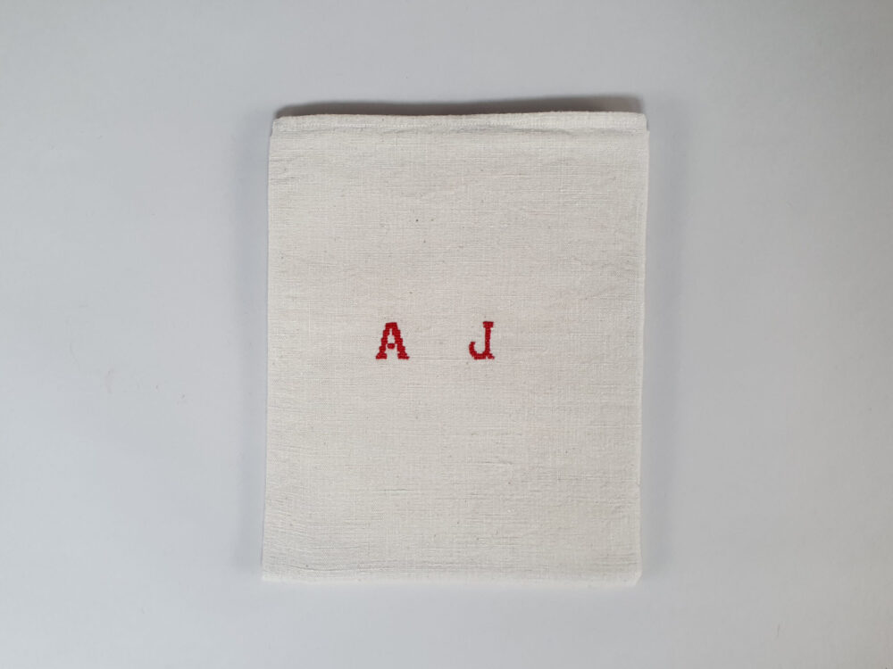 Antique linen hand woven Torchons, or Tea Towels, with red stripes & hand stitched monogram A J