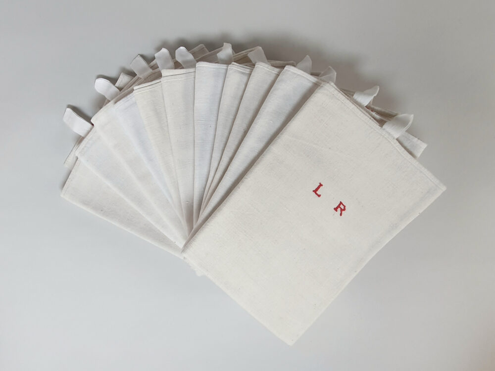 Antique linen hand woven Torchons, or Tea Towels, with red stripes & hand stitched monogram L R