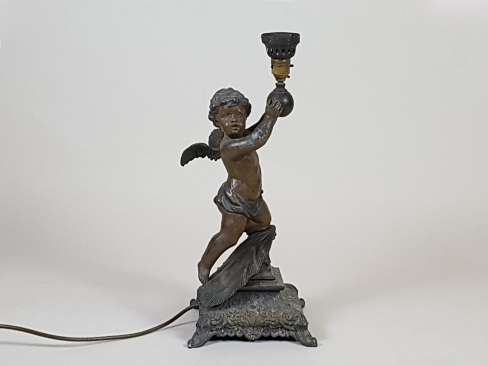 Antique metal Table Lamp featuring a Cherub