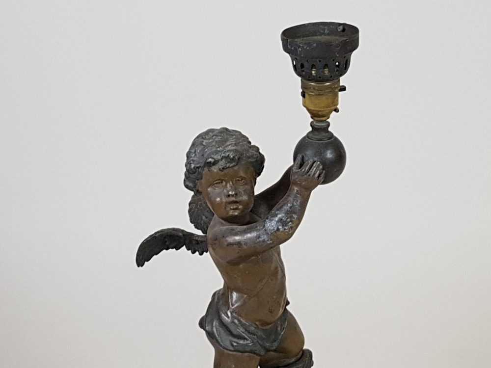 Antique metal Table Lamp featuring a Cherub