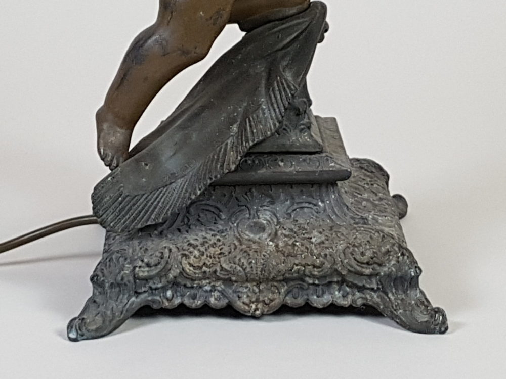Antique metal Table Lamp featuring a Cherub