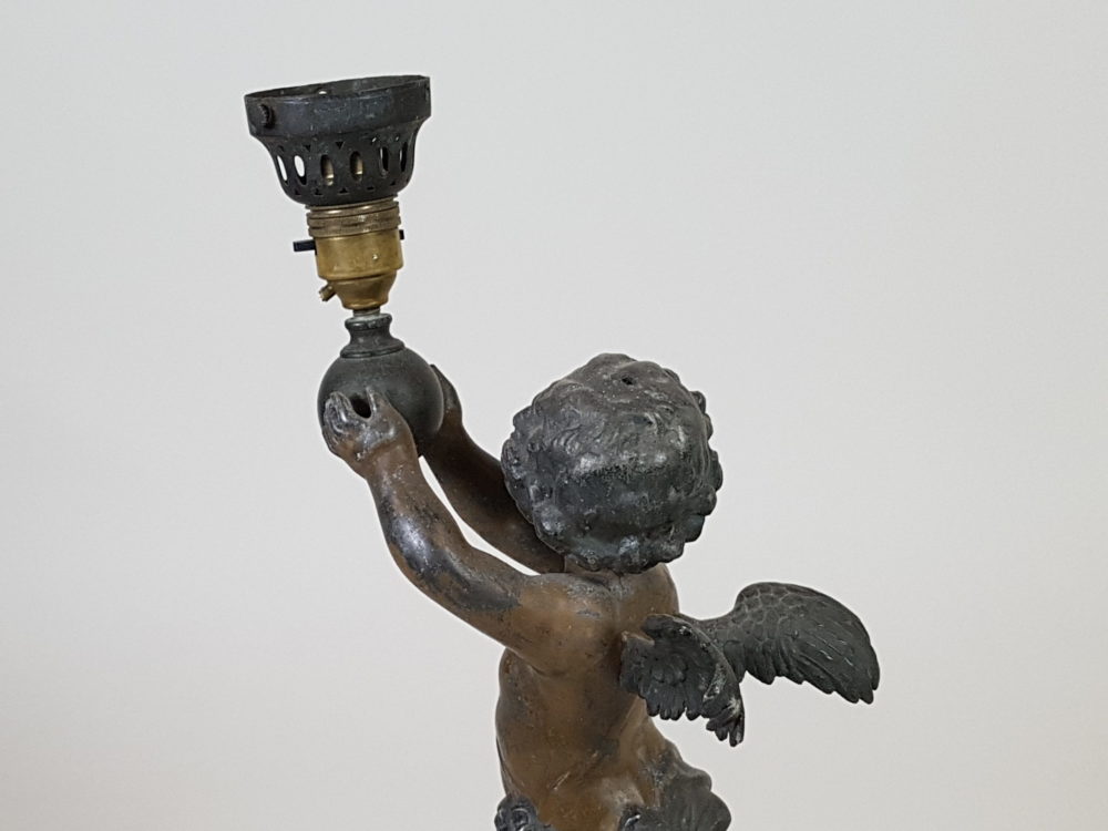 Antique metal Table Lamp featuring a Cherub