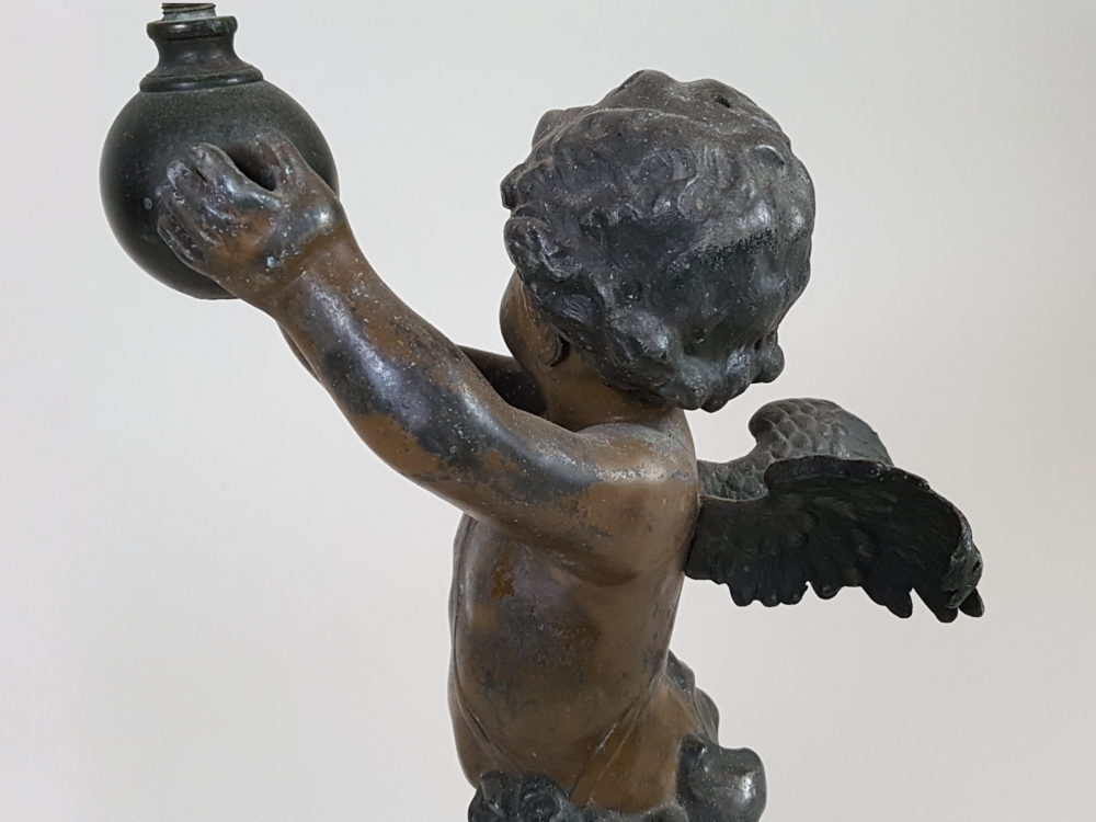 Antique metal Table Lamp featuring a Cherub