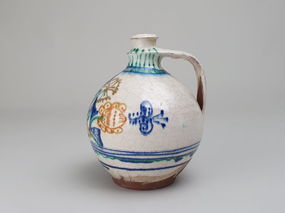 Antique rustic pottery bulbous Jug with hand painted folk art design