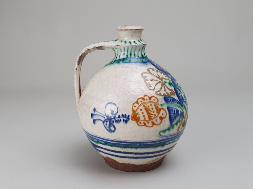 Antique rustic pottery bulbous Jug with hand painted folk art design