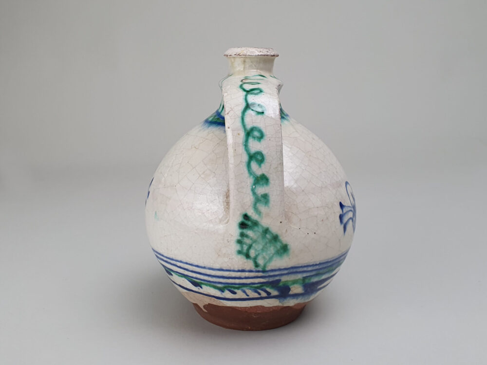 Antique rustic pottery bulbous Jug with hand painted folk art design