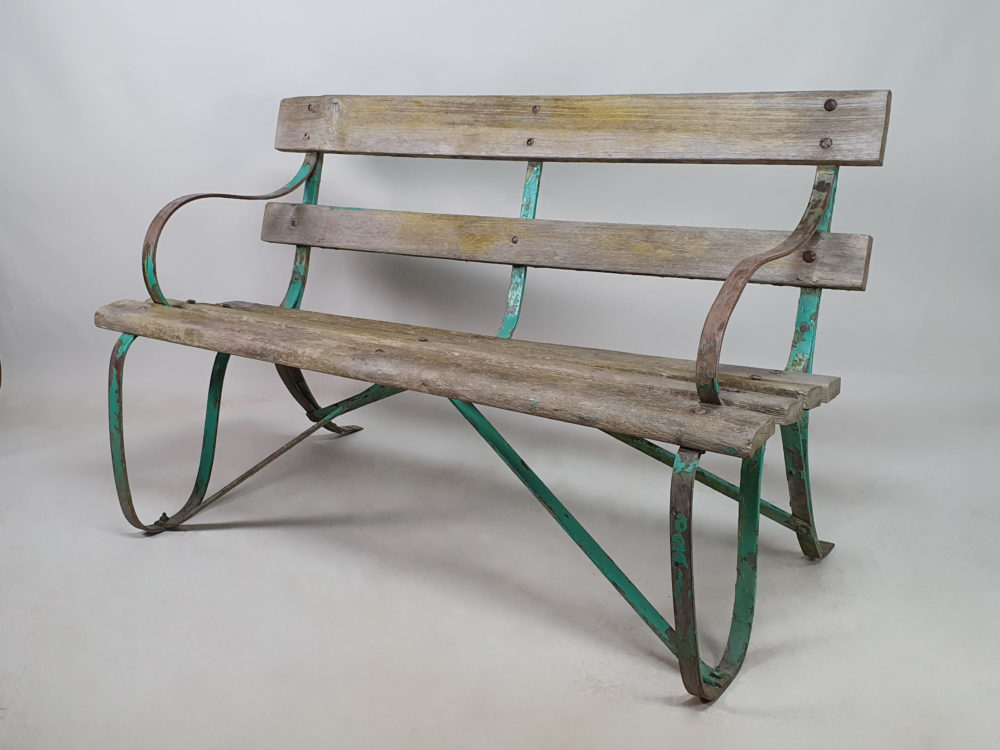 Antique wrought iron Garden Bench with wooden slats and old green paint
