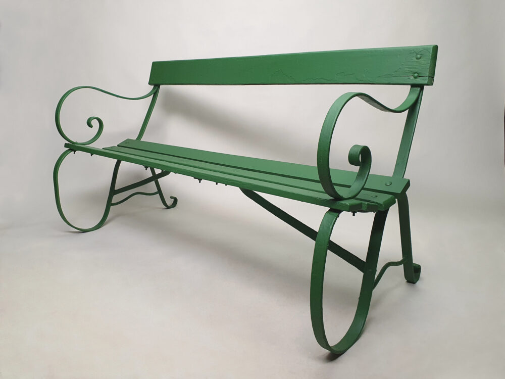 Antique wrought iron Garden Bench with wooden slats and old green paint