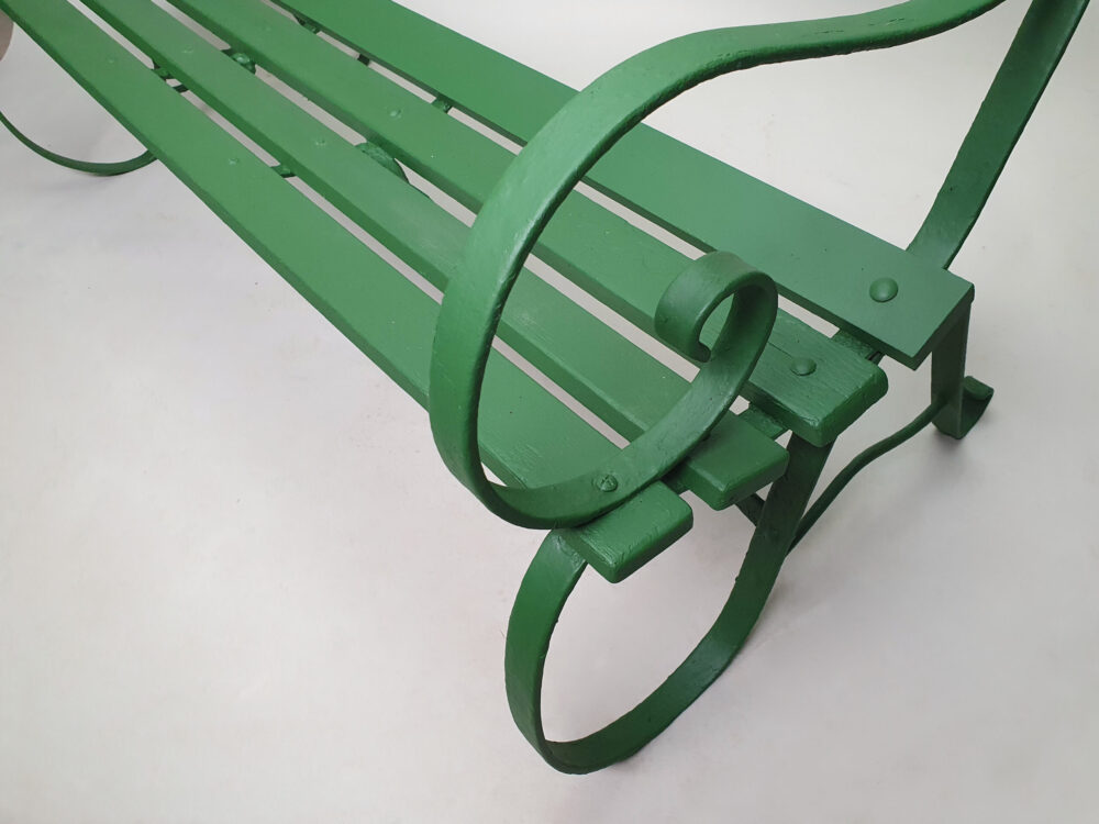 Antique wrought iron Garden Bench with wooden slats and old green paint