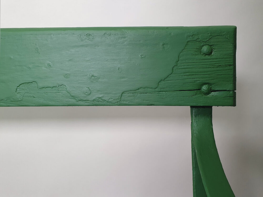 Antique wrought iron Garden Bench with wooden slats and old green paint