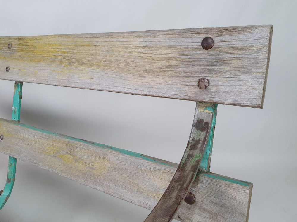 Antique wrought iron Garden Bench with wooden slats and old green paint