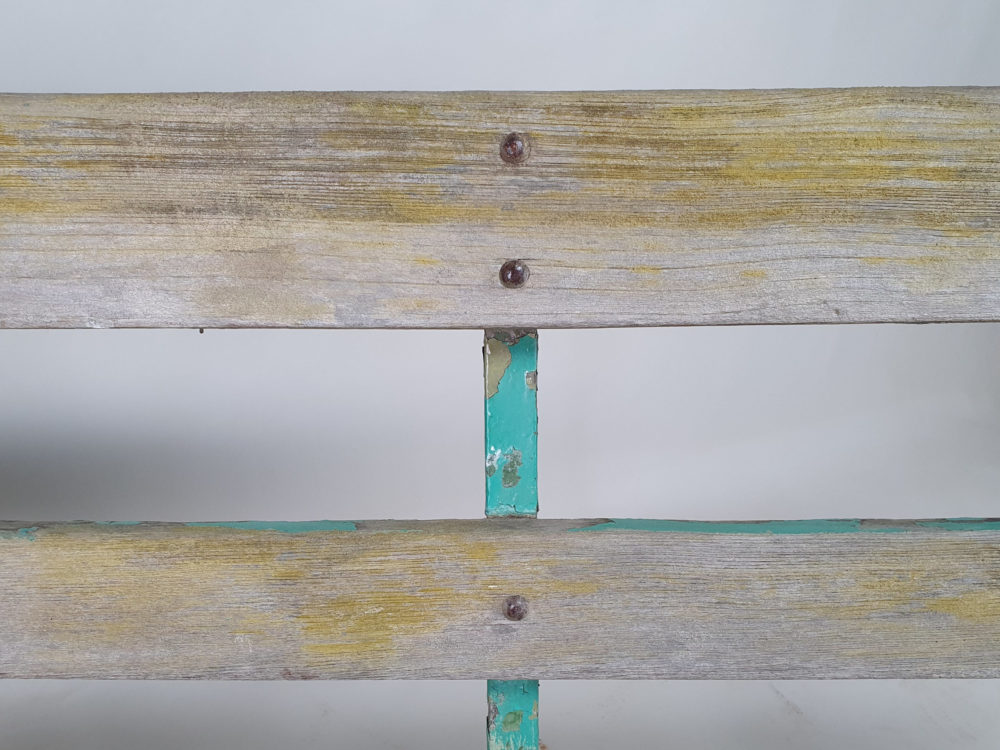 Antique wrought iron Garden Bench with wooden slats and old green paint