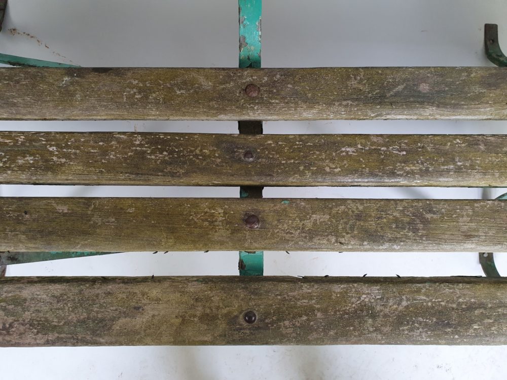 Antique wrought iron Garden Bench with wooden slats and old green paint