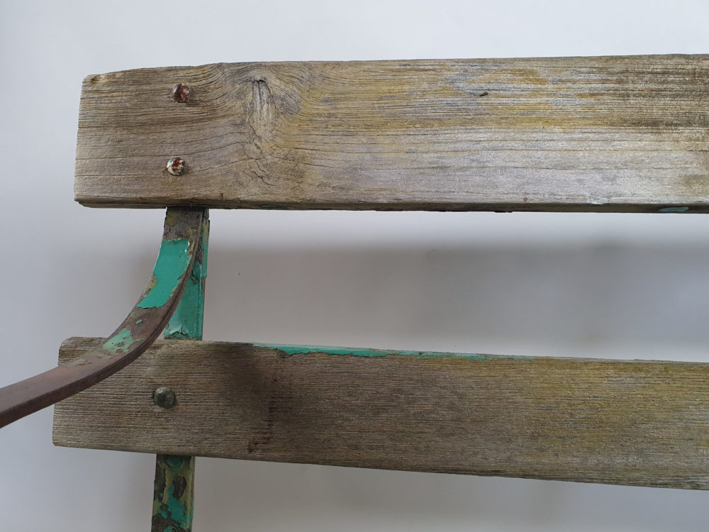 Antique wrought iron Garden Bench with wooden slats and old green paint