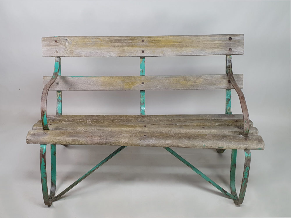 Antique wrought iron Garden Bench with wooden slats and old green paint