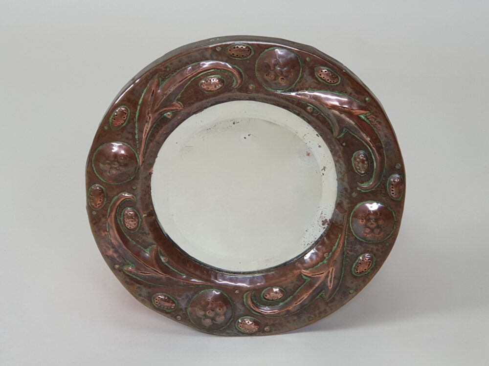 Arts and Crafts repoussé circular copper Mirror