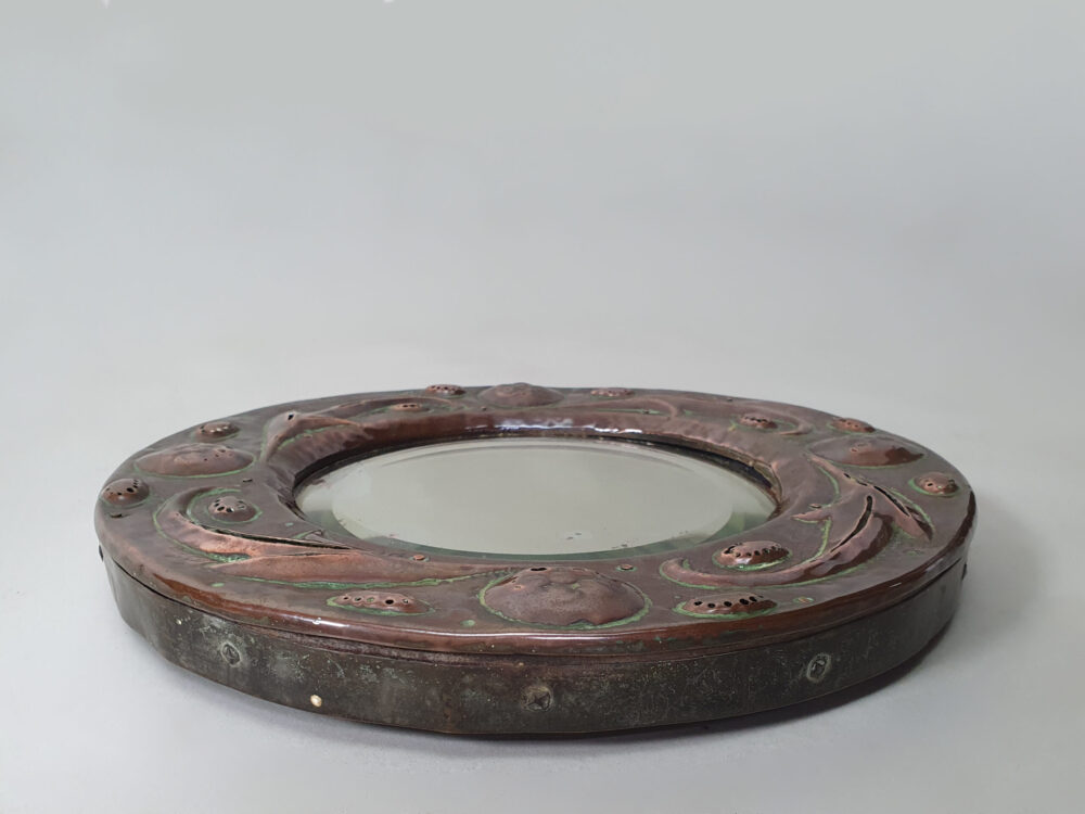 Arts and Crafts repoussé circular copper Mirror