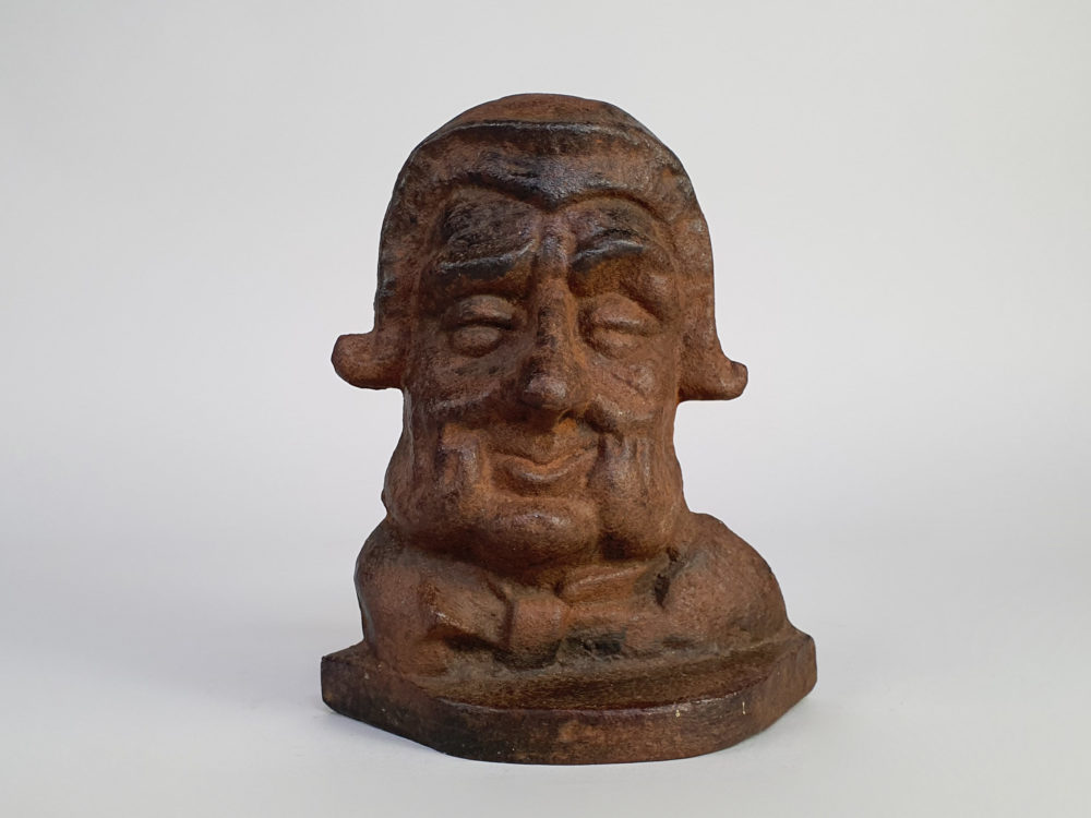 Cast iron antique Doorstop of a smiling Georgian gentleman's face