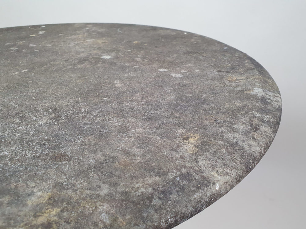 Circular Victorian garden table with an ornate cast iron base and bevelled marble top