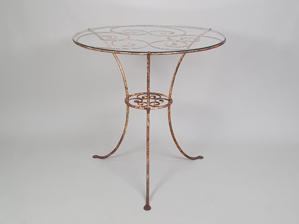 Circular metal antique Table with glass top