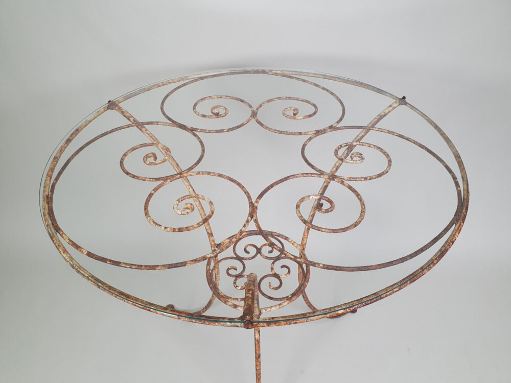 Circular metal antique Table with glass top