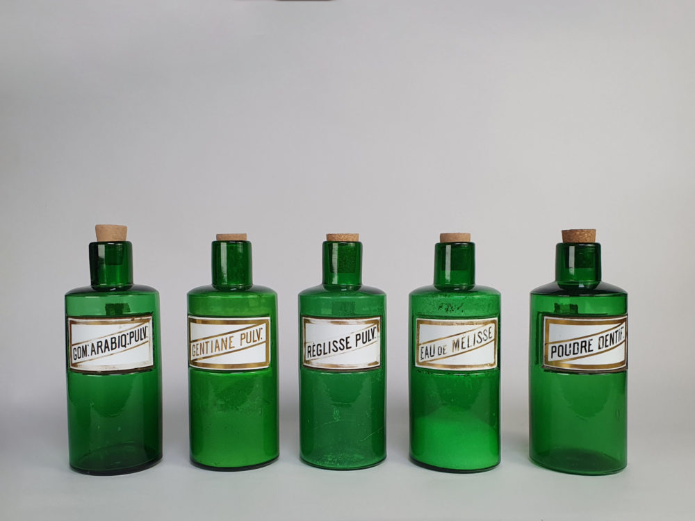 Decorative antique green French Pharmacy Bottles with porcelain labels
