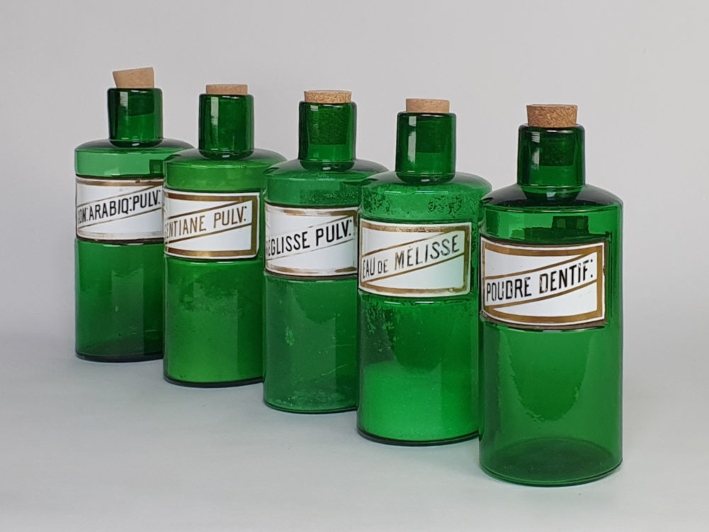 Decorative antique green French Pharmacy Bottles with porcelain labels